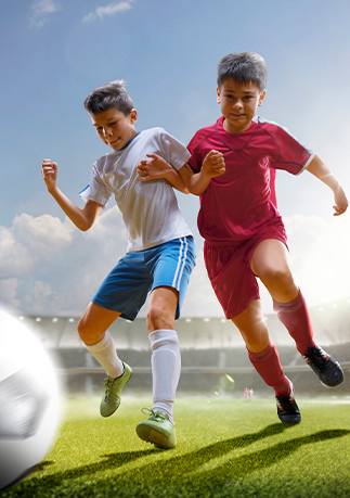 an image showing two teens playing soccer